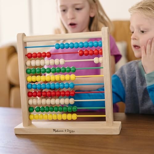 Children playing with a colorful abacus